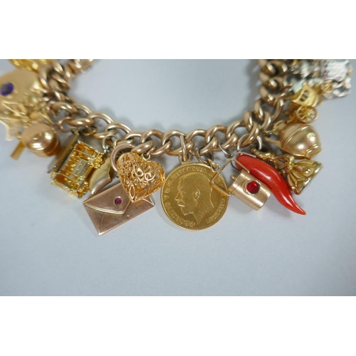 605 - A 9ct gold charm bracelet with numerous 9ct, 14ct, 18ct and 22ct gold charms, and a few yellow metal... 