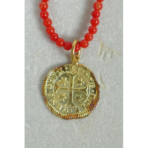 609 - An Italian natural red seed coral and 18ct gold medallion pendant necklace in the form of a 1655 Gen... 