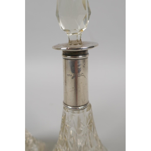 610 - A pair of hallmarked silver topped cut glass scent bottles, marks rubbed, 15cm high