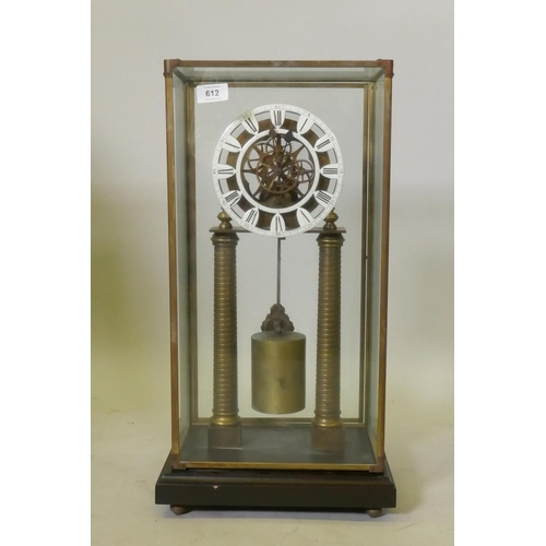 612 - A brass skeleton clock with enamel dial and single train movement, raised on a wood base with glass ... 