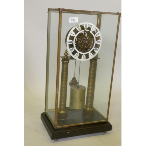 612 - A brass skeleton clock with enamel dial and single train movement, raised on a wood base with glass ... 