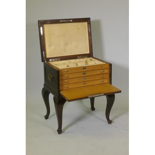 613 - 1930s oak canteen with lift up top and drop front revealing four fitted chamois lined drawers with c... 