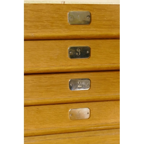 613 - 1930s oak canteen with lift up top and drop front revealing four fitted chamois lined drawers with c... 