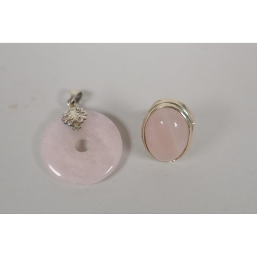 618 - A 925 silver and rose quartz dress ring, size R/S, and a matching pendant