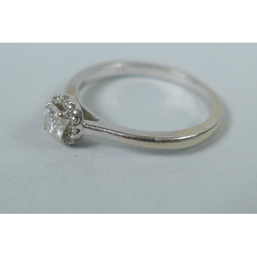 621 - A 9ct white gold diamond solitaire ring, approx ¼ct, size M