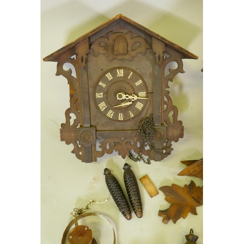 622 - Four Black Forest cuckoo clocks for repair, largest 40cm high