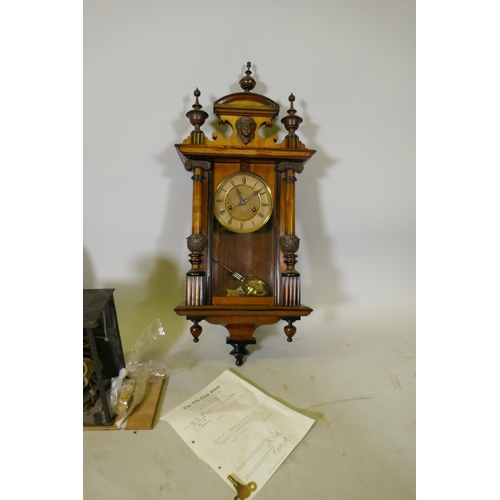 628 - A C19th walnut cased Vienna regulator wall clock, 79cm high, a French Comtoise clock with enamel dia... 