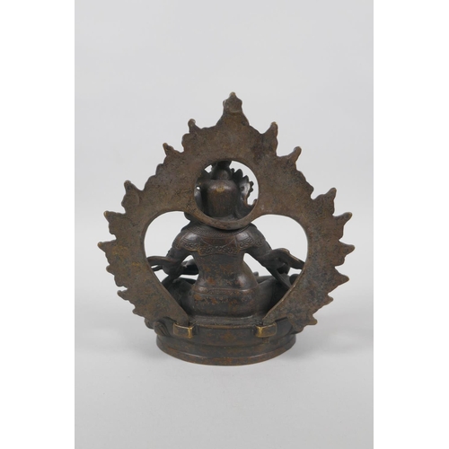 63 - A Tibetan bronze figure of Jambhalia, double vajra mark to base, 17cm high