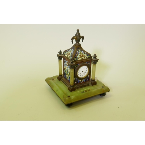 631 - A French champleve enamel inkwell, fitted with a clock and mounted on an alabaster base, 22cm high