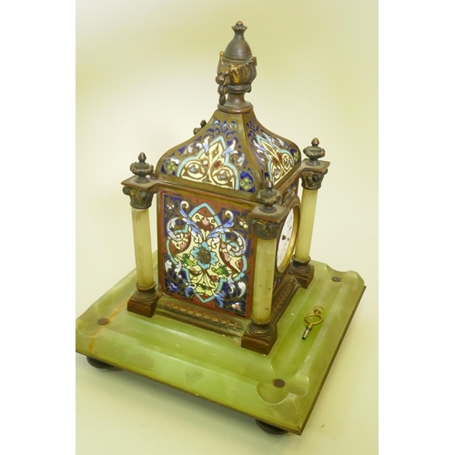 631 - A French champleve enamel inkwell, fitted with a clock and mounted on an alabaster base, 22cm high