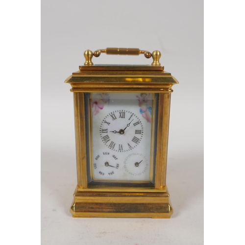 633 - A gilt brass carriage clock set with Sevres style pottery panels, 8cm high, the dial with smaller da... 