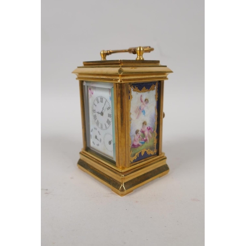 633 - A gilt brass carriage clock set with Sevres style pottery panels, 8cm high, the dial with smaller da... 