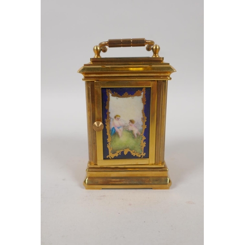 633 - A gilt brass carriage clock set with Sevres style pottery panels, 8cm high, the dial with smaller da... 