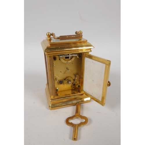 633 - A gilt brass carriage clock set with Sevres style pottery panels, 8cm high, the dial with smaller da... 