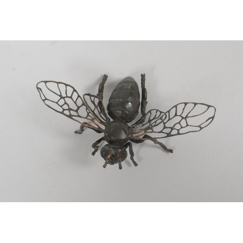 64 - A Japanese style bronze okimono wasp, 11cm wide