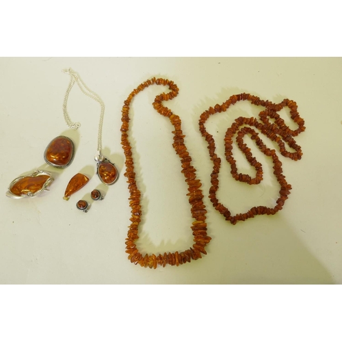 653 - A Baltic amber necklace, 96cm long, another 60cm long, and a silver mounted amber necklace, earrings... 