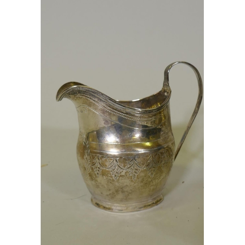 654 - A Georgian silver cream jug, London 1801, 93g; a silver bowl, Chester 1899, Stokes & Ireland 115... 