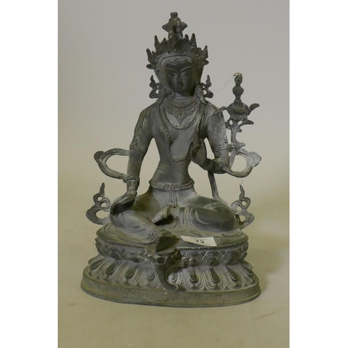 73 - Oriental bronze figure of Buddha seated on a lotus dias, 32cm high