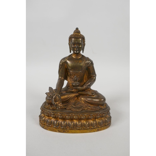 75 - A Tibetan gilt bronze figure of Buddha seated on a lotus throne, double vajra mark to base, 15cm hig... 