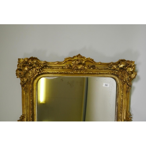 808 - A good C19th giltwood and composition picture frame with pierced crest and corners and arched rebate... 