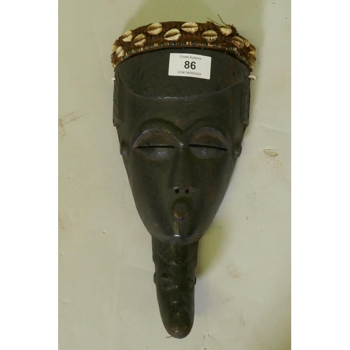 86 - African tribal mask, painted wood with applied textile headband inset with beads and shells, Kuba tr... 