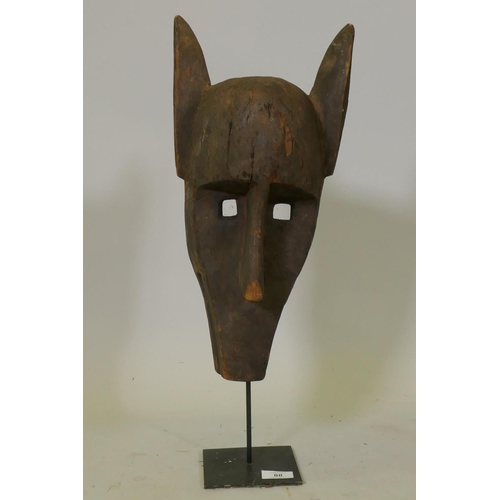 88 - African wood tribal mask, with etched decoration, Bambara tribe, Mali, mounted on a metal stand, 55c... 