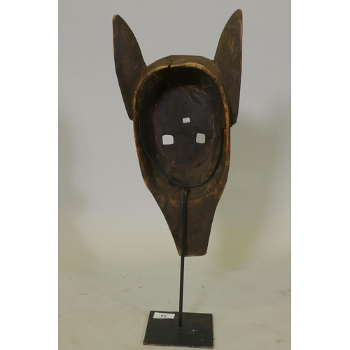 88 - African wood tribal mask, with etched decoration, Bambara tribe, Mali, mounted on a metal stand, 55c... 