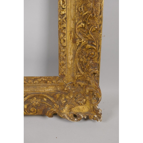 880 - An C18th carved giltwood picture frame with C scroll decoration, rebate 32 x 35cm