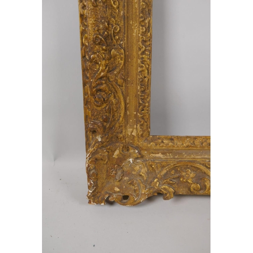 880 - An C18th carved giltwood picture frame with C scroll decoration, rebate 32 x 35cm