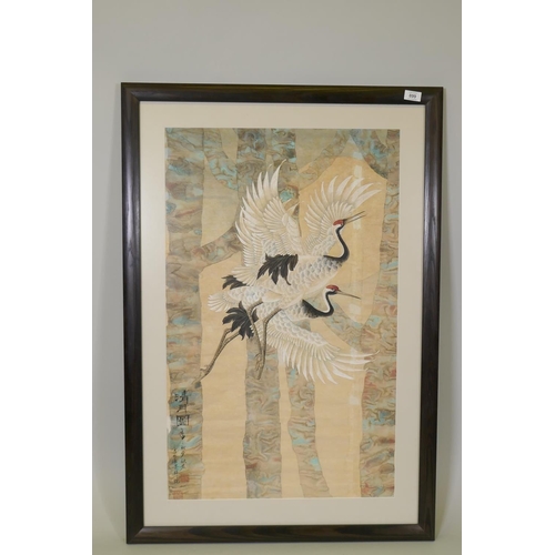 899 - A Chinese watercolour on paper of cranes in flight, with inscription and seal marks, 54 x 87cm