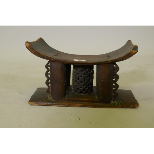 90 - Antique African carved wood Ashanti stool with pierced decoration, 36 x 15 x 21cm