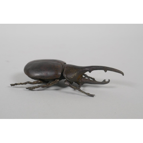 95 - A Japanese style bronze okimono of a hercules beetle, 10cm