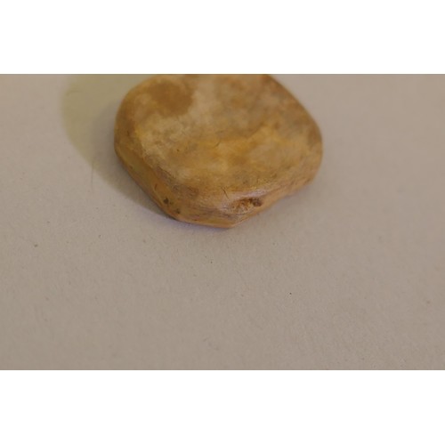 279 - A Middle Eastern stone intaglio, removed from a ring, carved with three lines of Islamic script, 16m... 