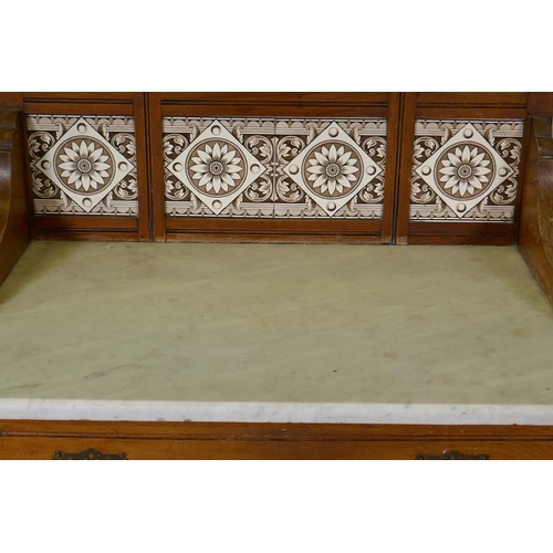 1107 - A Victorian walnut marble top washstand with tiled and mirror back over a single drawer and pot cupb... 