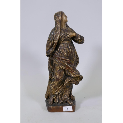 1 - A carved limewood figure of the Virgin Mary with polychrome and parcel gilt decoration and glass eye... 