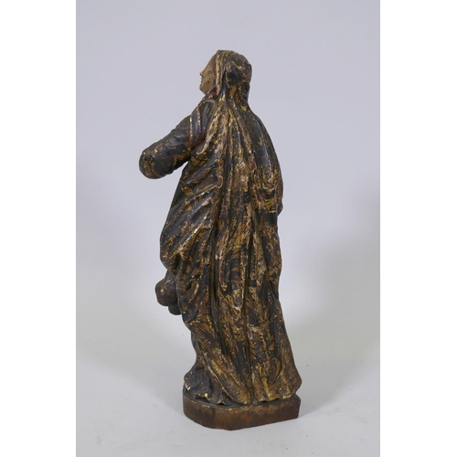 1 - A carved limewood figure of the Virgin Mary with polychrome and parcel gilt decoration and glass eye... 