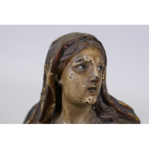 1 - A carved limewood figure of the Virgin Mary with polychrome and parcel gilt decoration and glass eye... 