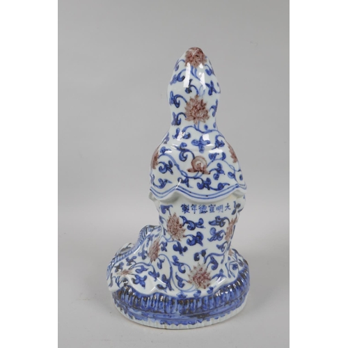 100 - A Chinese blue and white porcelain figure of Guanyin, Xuande 6 character mark to the reverse, 29cm h... 