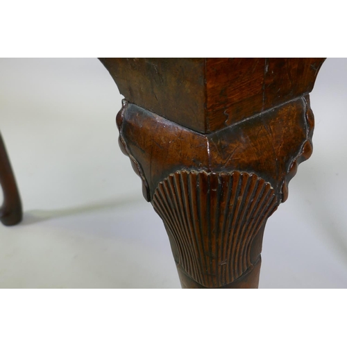 1001 - A Georgian walnut lowboy, the quarter veneered top with moulded edge and cut corners with herringbon... 