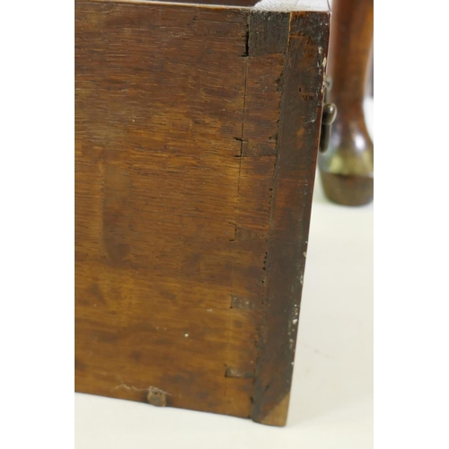 1001 - A Georgian walnut lowboy, the quarter veneered top with moulded edge and cut corners with herringbon... 