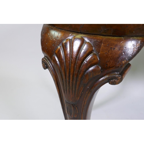 1002 - Georgian style walnut veneered kidney shaped foot stool, with drop in seat, raised on carved cabriol... 