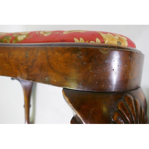 1002 - Georgian style walnut veneered kidney shaped foot stool, with drop in seat, raised on carved cabriol... 