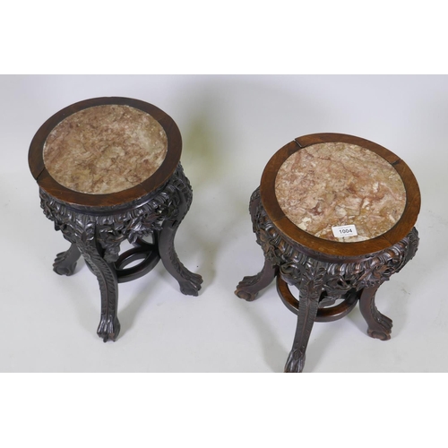 1004 - A pair of antique Chinese hardwood stands with inset rouge marble tops and carved and pierced frieze... 