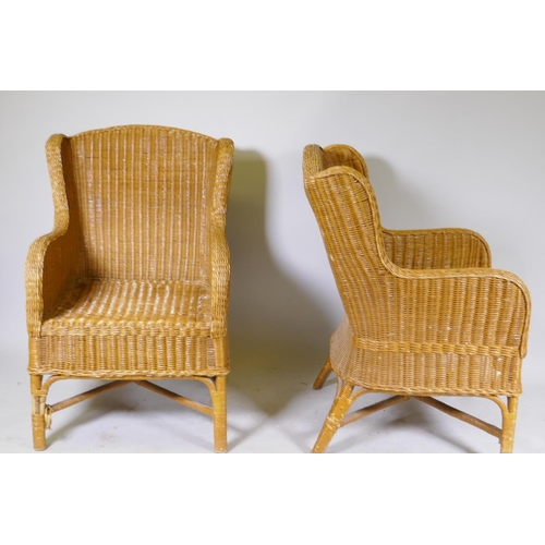 1008 - A pair of cane conservatory arm chairs