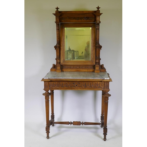 1009 - A C19th French walnut dressing table with swing mirror flanked by columns, grey marble top over a fr... 