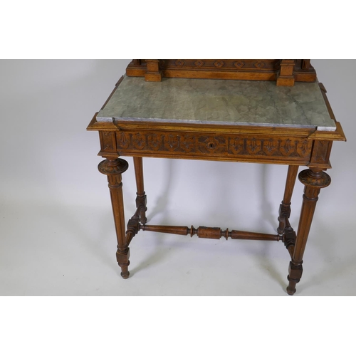 1009 - A C19th French walnut dressing table with swing mirror flanked by columns, grey marble top over a fr... 