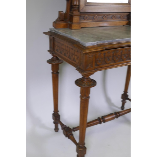 1009 - A C19th French walnut dressing table with swing mirror flanked by columns, grey marble top over a fr... 