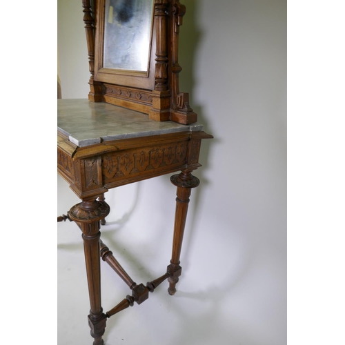 1009 - A C19th French walnut dressing table with swing mirror flanked by columns, grey marble top over a fr... 