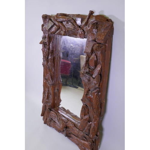 1012 - A painted driftwood frame wall mirror, 85 x 123cm