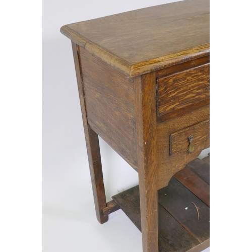 1013 - An oak side table with two long and three short drawers, and shaped apron with planked undertier, 92... 